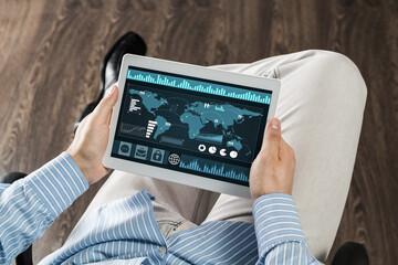 businessman with tablet on his lap