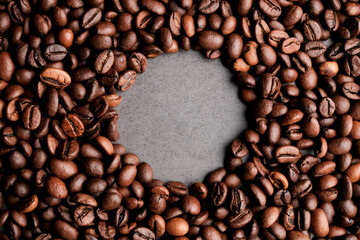 Coffee beans frames at dark gray background. Copy space 