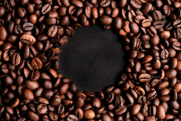 Coffee beans frames at dark gray background. Copy space 