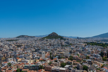 Fototapeta na wymiar Acropolis, Athens Greece,July 27, 2017 Mount Lycabettus a view from the Acropolis at Athens
