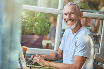 Fototapeta premium Middle aged caucasian man working on computer