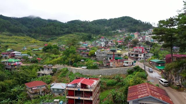 Aerial view town of Sagada, located in the mountainous province of Philippines. City in the valley among the mountains covered with forest. Sagada-Cordillera region-Luzon island.