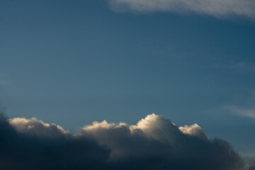 Fototapeta na wymiar Autumnal clouds with blue sky beyond,United Kingdom.cumulus,fluffy,white,