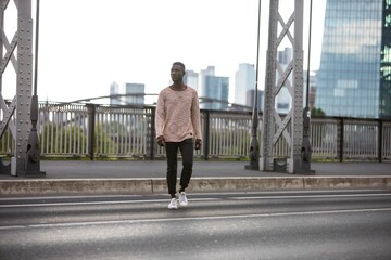 Man Walking Across Street with Head Turned