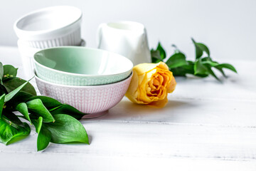 ceramic tableware with flowers on white background