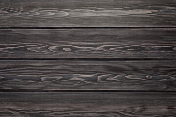 Textured wood surface. Natural background from larch boards. Dark color