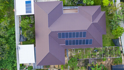 Aerial top view of the solar cells on the roof, Solar panels installed on house roof