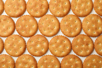 Flat lay with cracker biscuits on white background