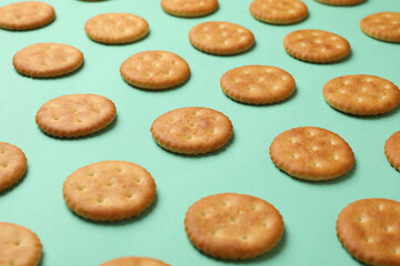 Flat lay with cracker biscuits on mint background