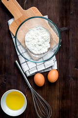 cooking pancake on wooden background top view ingredients for making