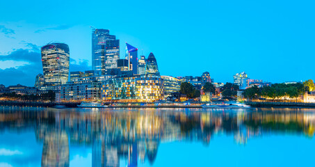 Panorama of the modern skyline on Thames river at twilight blue hour   - London, United Kingdom