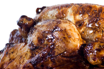 Roast chicken on a wooden tray on white background