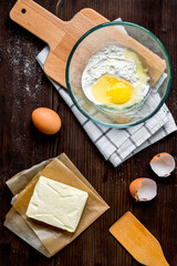 cooking pancake on wooden background top view ingredients for making