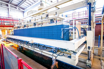 automated industrial equipment at the factory in production hall