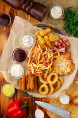 set of beer snacks. appetizers and salty. Pile of food for big company. Party, sport bar, pub, restaurant menu