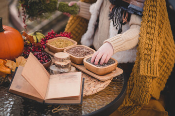 Child reading recipe book to prepare to halloween