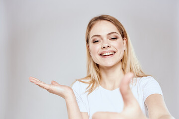 Fototapeta premium emotional blonde white t-shirt close-up studio lifestyle fun