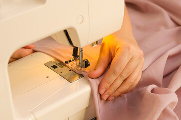 Working on a sewing machine close-up