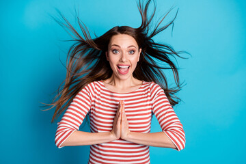 Photo of positive cheerful astonished girl impressed long waited lucky gift put hands together...