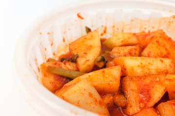 Radish kimchi on white background