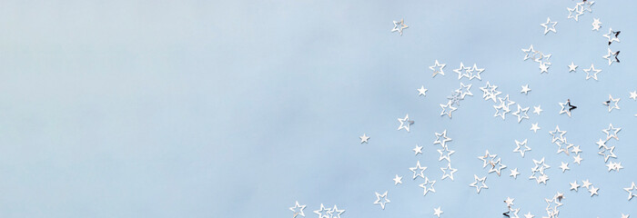 silver stars on light blue background banner
