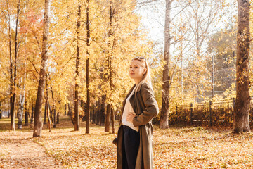 Woman with coffee in the park.