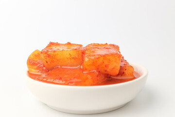 Radish kimchi on white background