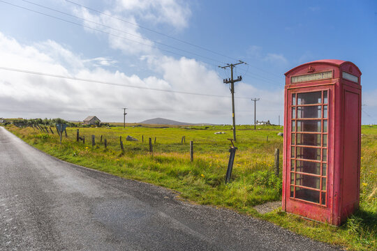 Red telephone box and crofters houses at North Uist, Outer Hebrides, Scotland