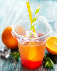 Fresh cocktail with orange and ice