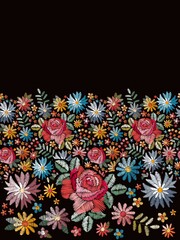 Floral embroidery. Seamless embroidered border with bright colorful flowers on black background. Print for summer dresses. Fashion design. Vector illustration.