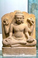 Fototapeta premium Sandstone Buddha statues of the culture of the Mekong Delta in the 6th century. This is art of meticulous stone sculpture to honor beauty of Buddhist culture and spirituality at that time in Vietnam