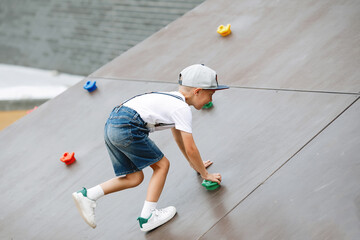 Boy on a climbing wall