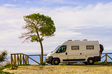 Camper van on seaside cliff, Spain