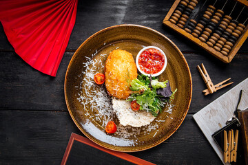 Dish of chicken fillet Kiev cutlet with rice