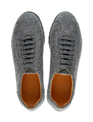 Beautiful pair of demi-season men's shoes made of gray monochrome wool on laces and black sole with ribbed tread, isolated on a white background with a shadow. Top view.
