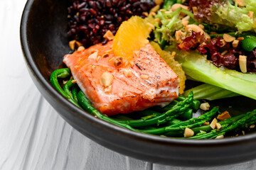 Warm salad with salmon, wild rice and asparagus