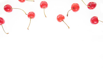 red raw fresh cherries on white background, close view 