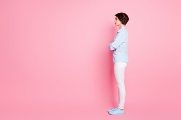 Full length body size profile side view of her she nice attractive calm content brown-haired girl folded arms copy empty blank place space advert isolated over pink pastel color background