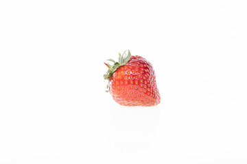 red raw fresh strawberry on white background, close view 