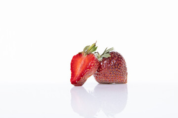 red raw fresh strawberries on white background, close view 