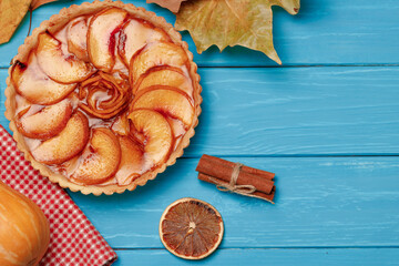 Apple tart pie on blue wooden background
