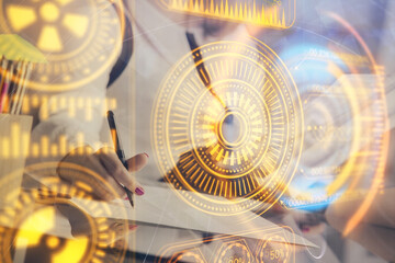 Technology theme hologram over woman's hands taking notes background. Concept of Tech. Double exposure