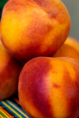 Fototapeta na wymiar Stacked Peaches on a table