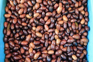 Stall with Kalamata or Kalamon olives at street market in Athens, Greece.