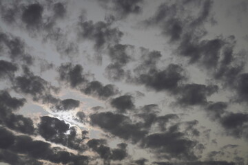 Rain clouds accumulating in the sunset sky.