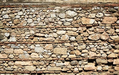 Wall of ancient stones in Athens, Greece.