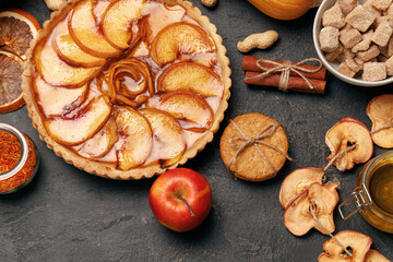 Apple tart pie on black surface close up