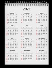 calendar for 2021 on paper spiral notebook isolated on white backgrounds