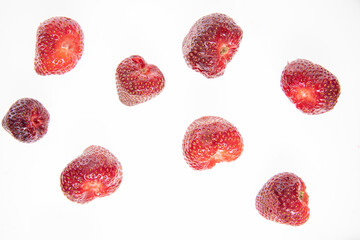 red raw fresh strawberries on white background, close view 
