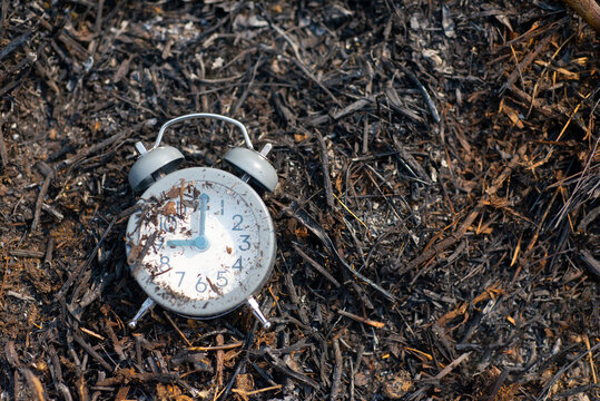 The picture shows the concept of time, a clock placed on an open soot.